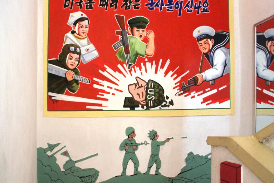 “Are you excited about the military game of beating up Americans?” is the slogan on this wall display on a staircase landing in the Kindergarten on Chonsamri Co-operative farm, near Kangsŏ, North Korea. 